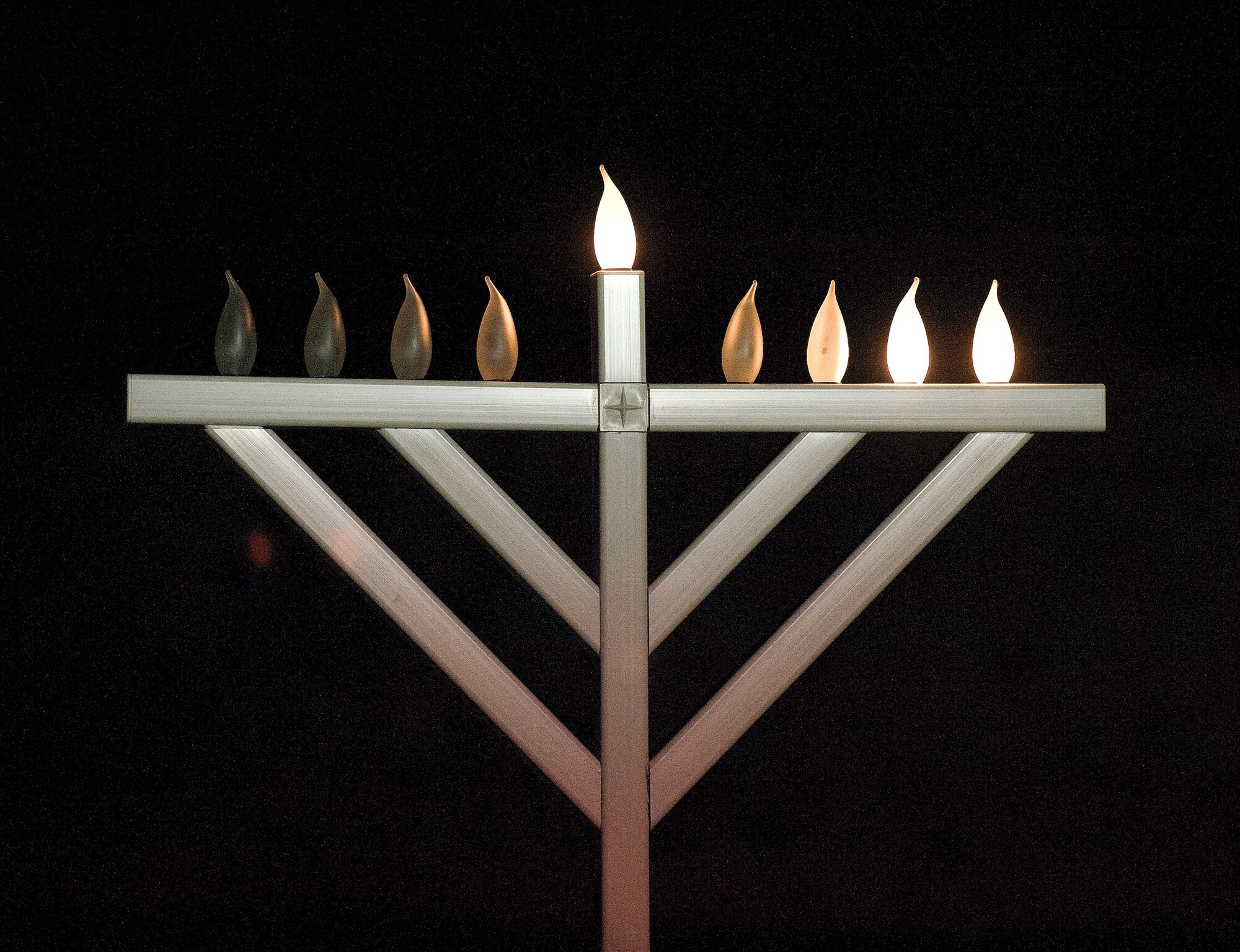 The Menorah was lit during the Christmas tree and Menorah lighting Dec. 2, 2010 at the Dover Air Force Base, Del., chapel. (U.S. Air Force photo by Jason Minto/Released)