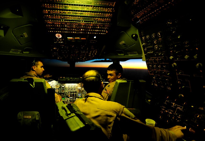 A KC-10 Extender aircraft crew assigned to the 908th Expeditionary Air Refueling Squadron, 380th Air Expeditionary Wing, discuss flight operations during an air refueling mission over Afghanistan in support of Operation Enduring Freedom on Nov. 25, 2010. As of Oct. 31, 2010, Airmen supporting the air refueling mission in the U.S. Central Command area of responsibility have off-loaded more than 880 million pounds of fuel to more than 69,000 aircraft for wartime operations in 2010, Air Forces Central statistics show. (U.S. Air Force Photo/Staff Sgt. Andy M. Kin)