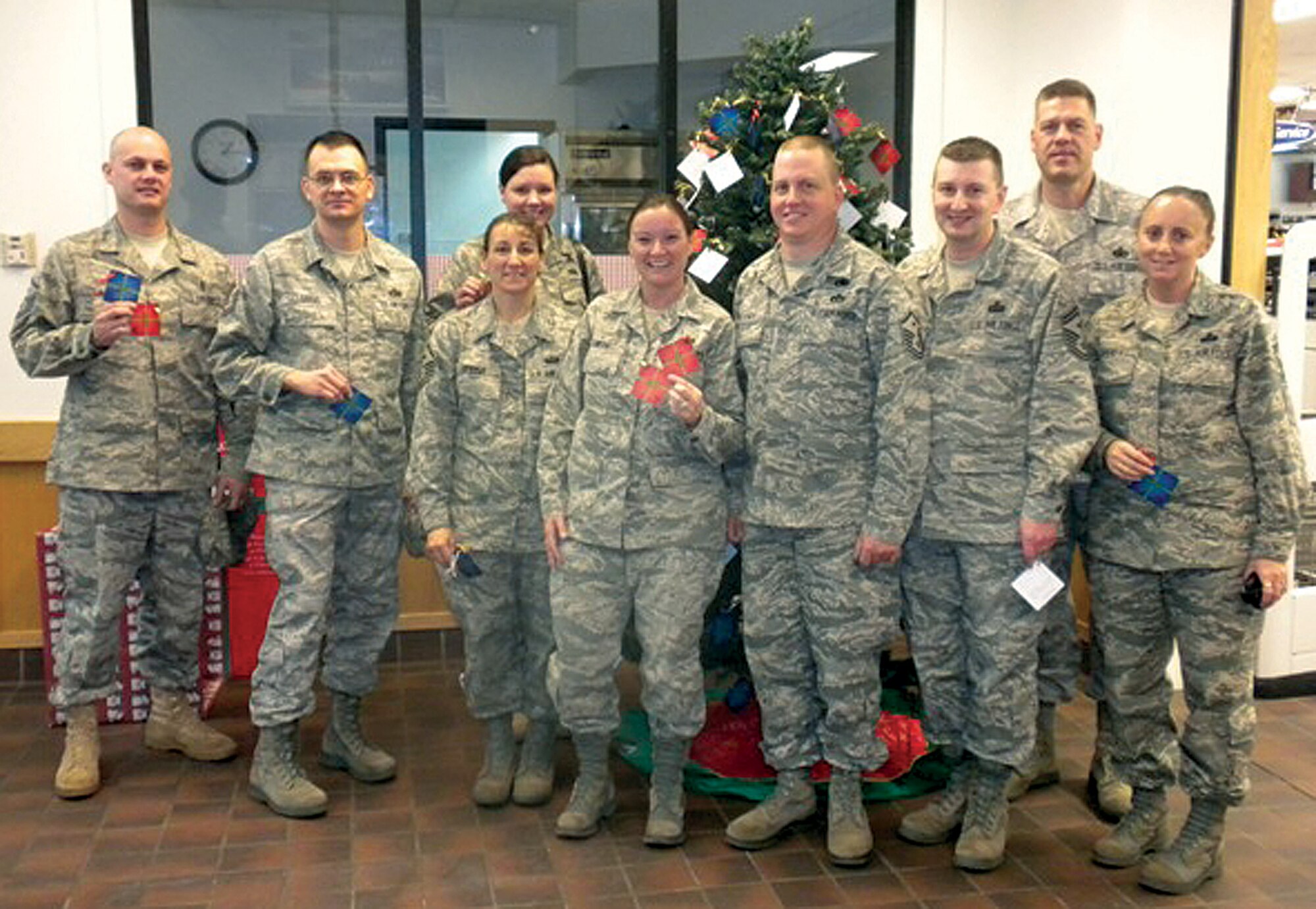 F. E. Warren fist sergeants stand in front of this year’s Angel Tree located in the Base Exchange on Nov. 20. (courtesy photo)