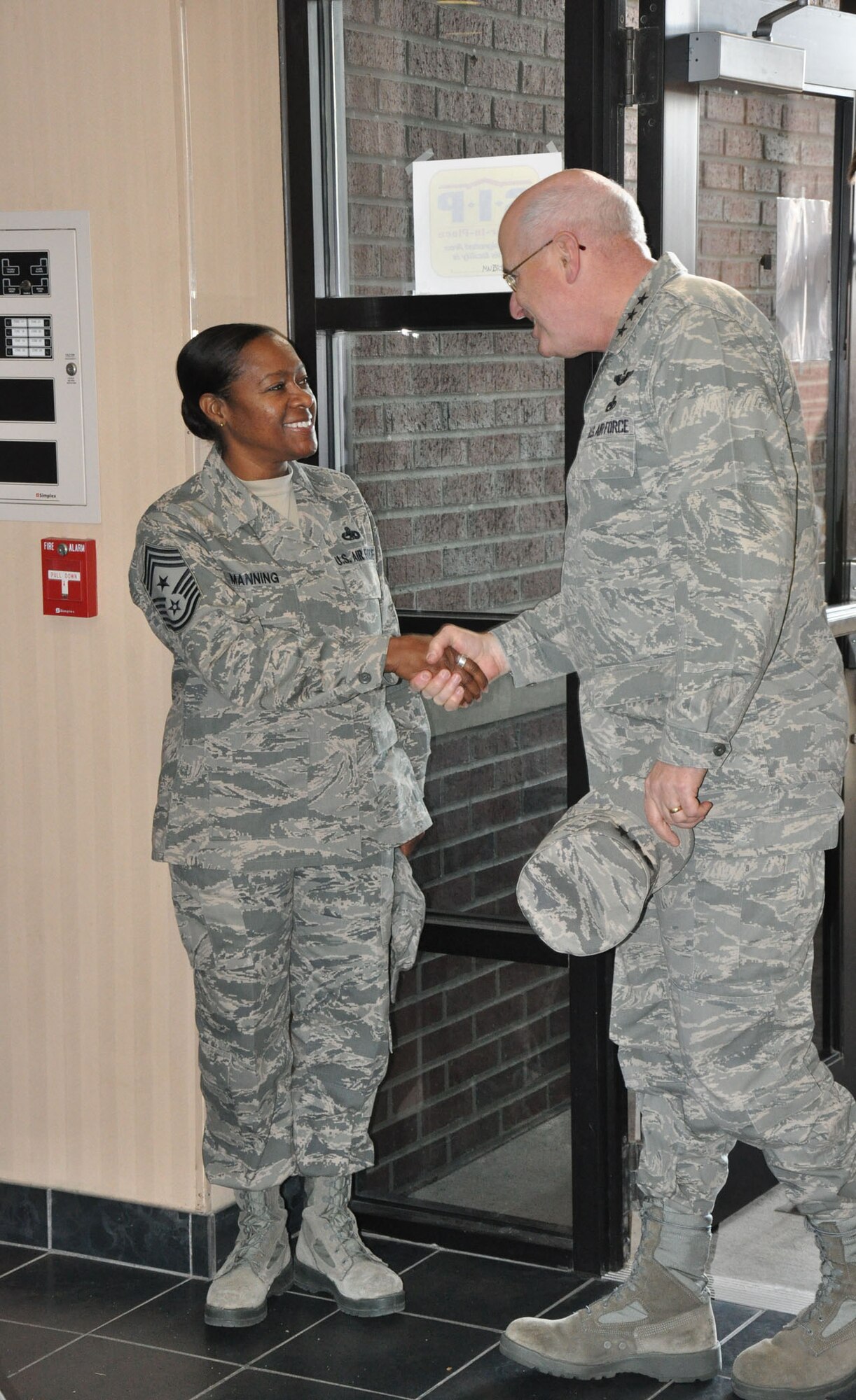 Chief Master Sgt. Gigi Manning, 315th Airlift Wing command chief master sergeant, welcomes Lt. Gen. Loren Reno, Deputy Chief of Staff for Logistics, Installations and Mission Support during an official visit to Joint Base Charleston, S.C. Dec. 4, 2010. (U.S. Air Force photo/Senior Airman Robert Pilch) 
