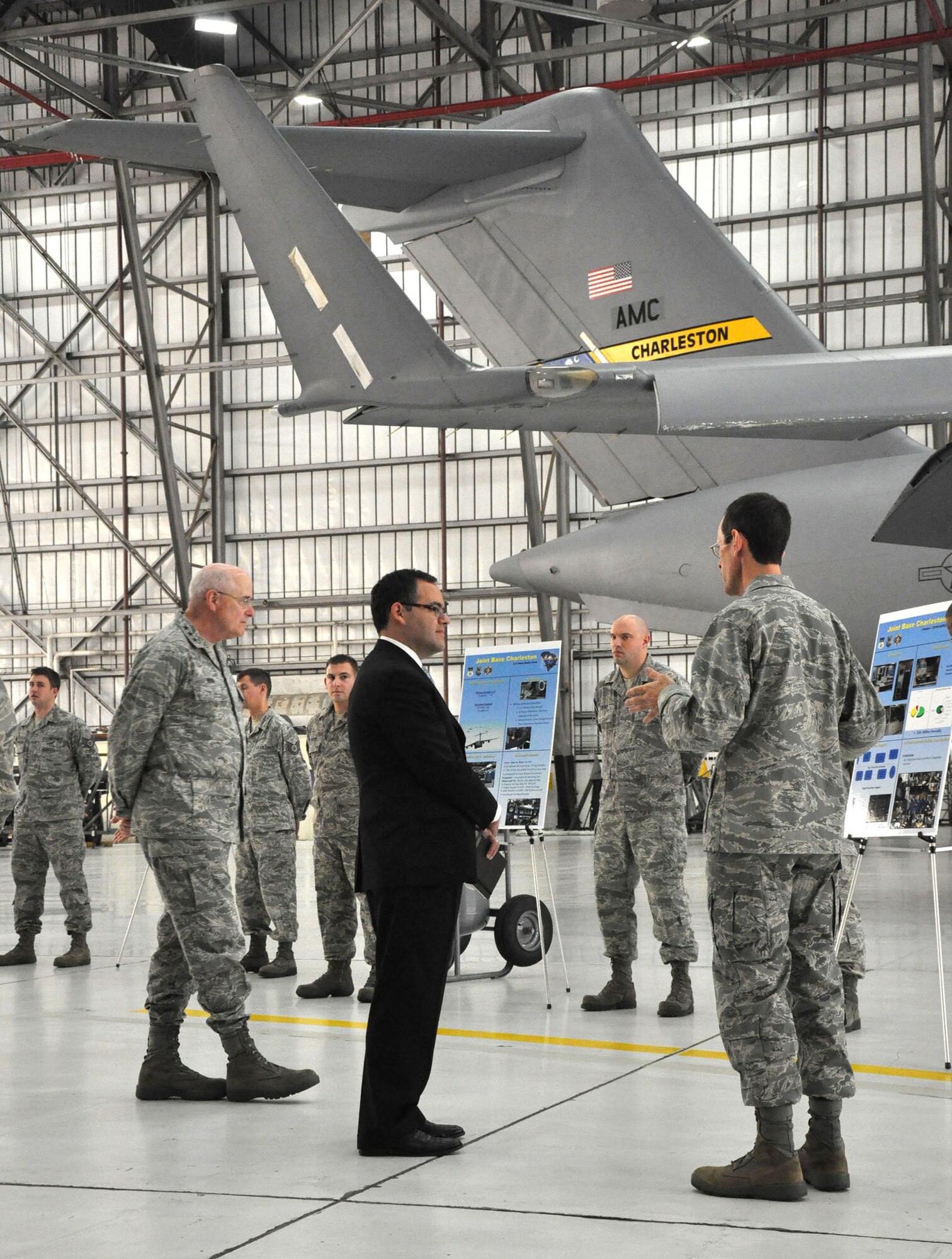 Lt. Col. Darryl Frazier, Deputy Commander of the 315th Maintenance Group, briefs Secretary Daniel Ginsberg, Assistant Secretary of the Air Force for Manpower and Reserve Affairs, on the side-by-side relationship between the reserve and active duty components during an official visit to Joint Base Charleston, S.C. Dec. 4, 2010. (U.S. Air Force photo/Senior Airman Robert Pilch) 
