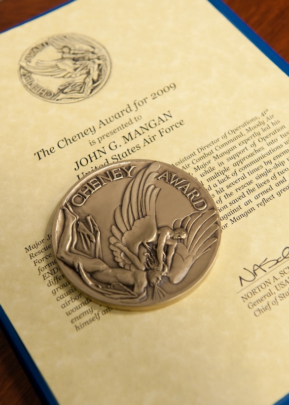 Maj. John Mangan was named the recipient of the Cheney Award in a ceremony Oct. 15, 2010, at the Pentagon. Major Mangan received the award for his actions as the pilot of an HH-60 Pave Hawk on a rescue mission in the Helmland Valley of Afghanistan in 2009 while supporting Operation Enduring Freedom.  Without ground communications or airborne support, Major Mangan managed to land and save the lives of two critically injured Marines under intense enemy fire. The Cheney Award is presented each year to aviators who demonstrate an act of valor, extreme fortitude or self-sacrifice in a humanitarian venture. Established in 1927, the award is in memory of 1st Lt. William Cheney, who was killed in an air collision over Italy in 1918. (U.S. Air Force photo/Jim Varhegyi) 
