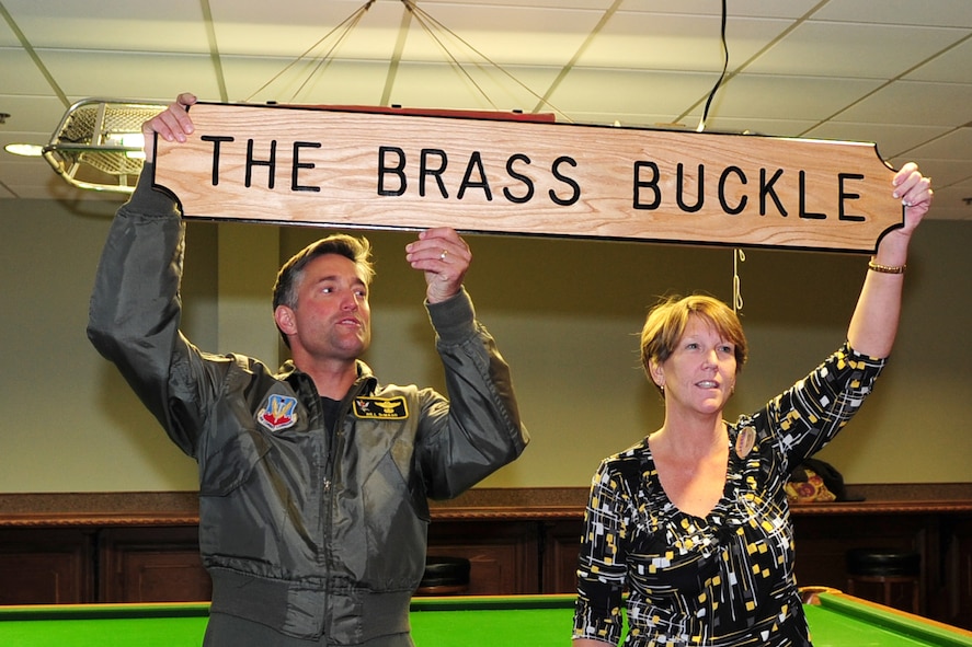 MOODY AIR FORCE BASE, Ga. -- Col. William DeMaso, 23rd Wing vice commander, announces the name of the newly renovated Officer's Lounge Dec. 3. Retired Master Sgt. Rudy Hill came up with the name, The Brass Buckle, to symbolize brass as what officers wear on their shoulders and the buckle as the unity that officers create. (U.S. Air Force photo/Senior Airman Stephanie Mancha)(RELEASED)