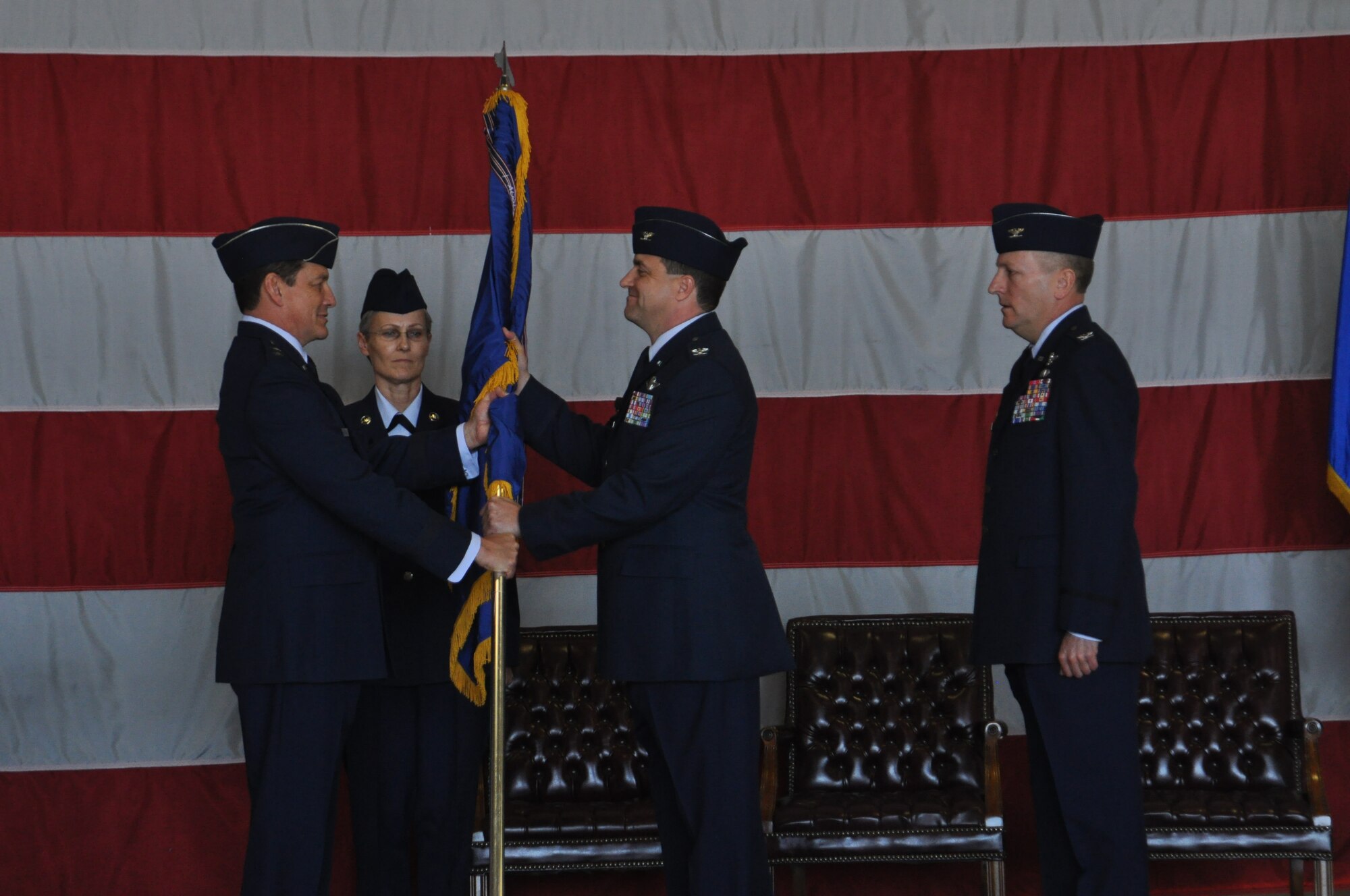 Maj. Gen. Frank J. Padilla, Commander of 10th Air Force, passes the 419th flagship to Col. Keith A. Knudson, newly appointed 419th Fighter Wing commander, at the wing's change of command ceremony Dec. 5. (U.S. Air Force photo/Staff Sgt. Alan Schultz) 