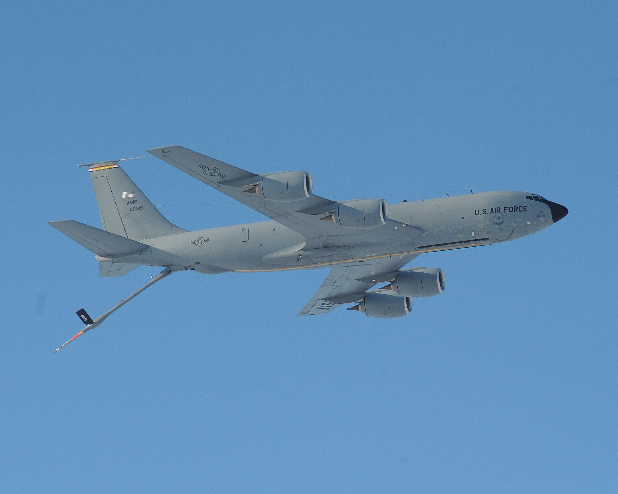 The last KC-135 Stratotanker formerly stationed at Grand Forks Air Force Base performs a low approach with its boom fully extended in one last salute to the men and women stationed here on Dec. 4 after taking off for the final time. The departure of this aircraft signaled the end to the rich history of the KC-135 air refueling mission. (U.S. Air Force photo by Tech. Sgt. Johnny Saldivar)