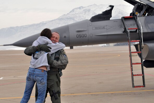 Col. Walter "Buck" Sams, 419th Fighter Wing commander, embraces daughter, Tori, after his fini flight Dec. 4. (U.S. Air Force photo/Staff Sgt. Heather Skinkle)