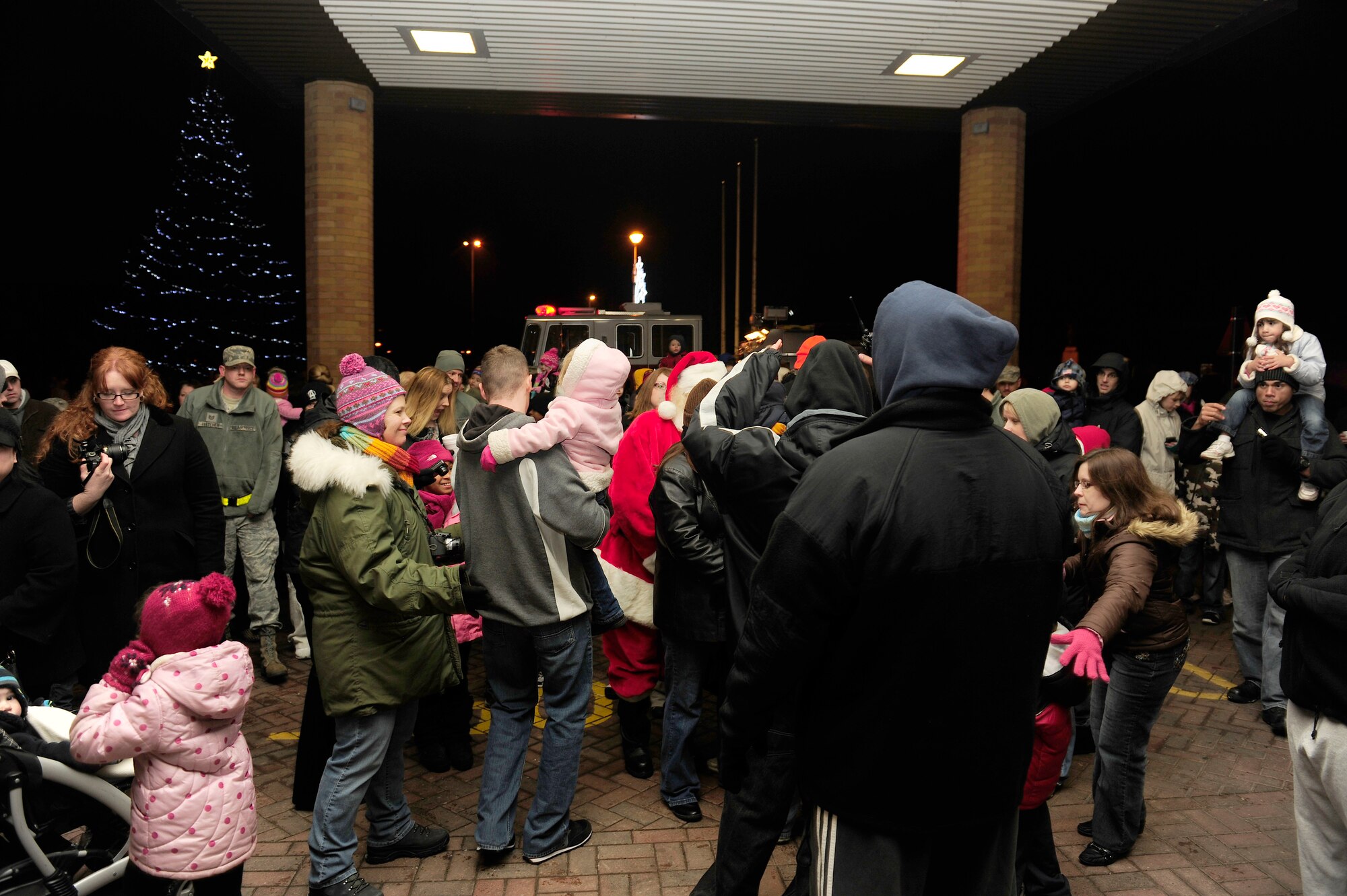 Residents of RAF Lakenheath gather in front of the 48th Medical Group to see the annual Christmas tree lighting ceremony Dec. 3. The event, presided over by 48th Fighter Wing Commander Col. John Quintas, celebrated the kick off of the holiday season for Lakenheath. (U.S. Air Force photo Airman 1st Class Tiffany M. Deuel)