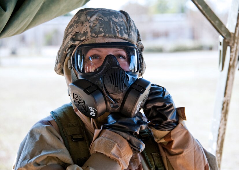 Staff Sgt. Alicia Mangan, 96th Medical Operations Squadron, wears the new M-50 gas mask and chemical suit top during her hands-on training at Eglin Air Force Base, Fla.  Gas masks and chemical gear are issued to Airmen prior to deploying or at their deployed location. (U.S. Air Force photo/ Samuel King Jr.)    