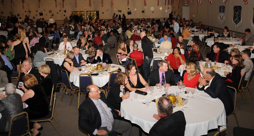 Members of the 2nd Bomb Wing attend the wing's "Holly" Day party at Hoban Hall on Barksdale Air Force Base, La., Dec. 2. The party was held on behalf of Col. Tim Fay, 2 BW commander. (U.S. Air Force photo/Airman 1st Class Sean Martin)
