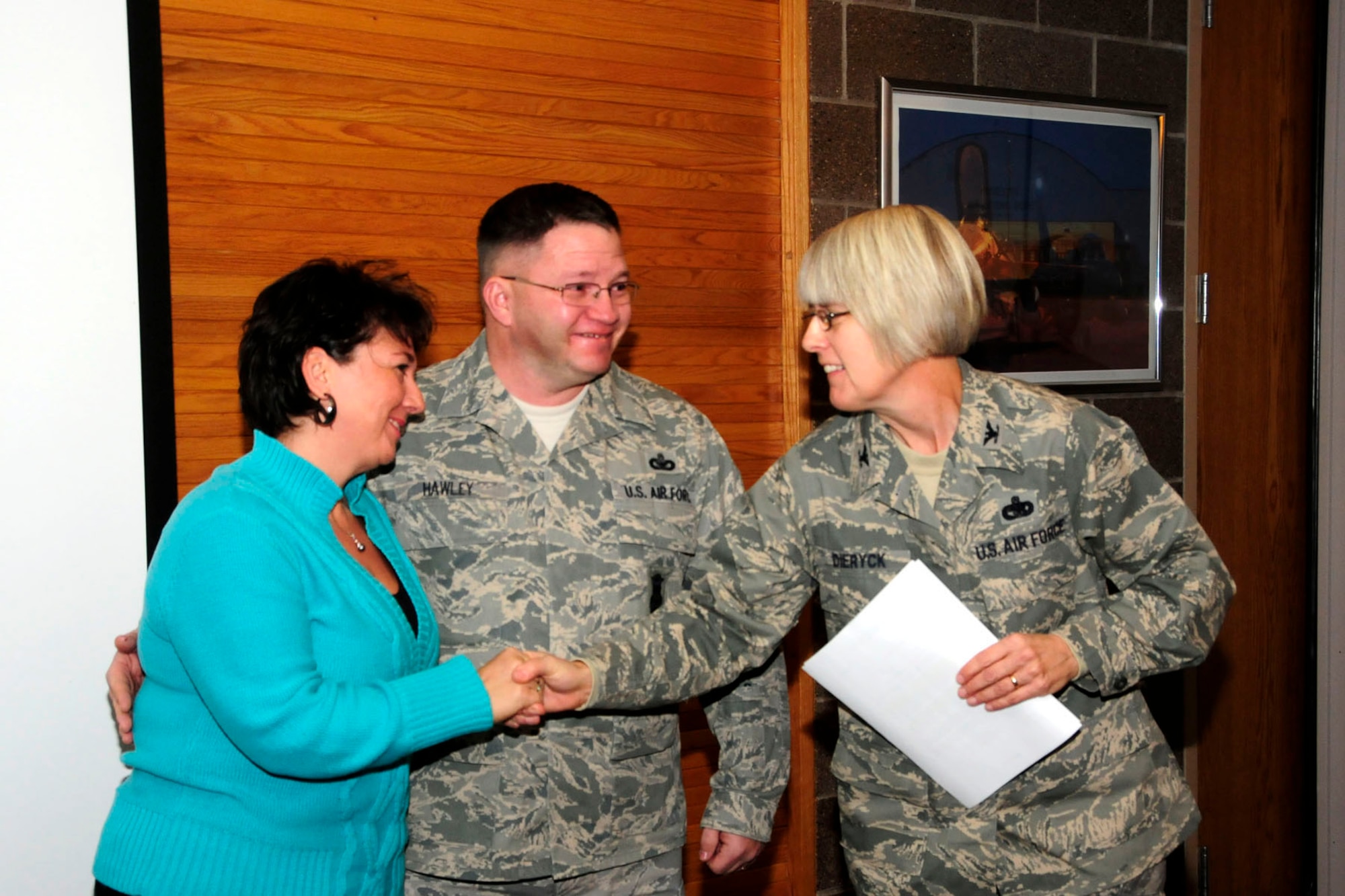U.S. Air Force Master Sgt. William Hawley (center) and Mrs. Hawley (left) were congratulated by Colonel Penny Dieryck during the Wing Commander's Call at the 148th Fighter Wing, Minnesota Air National Guard base,  in Duluth, Minn. on December 05, 2010.  Master Sgt. Hawley was awarded the 2010 Air National Guard Security Forces Senior Noncommissioned Officer of the Year award.  (U.S. Air Force Photo by Tech. Sgt. Amie M. Dahl/ Released)

