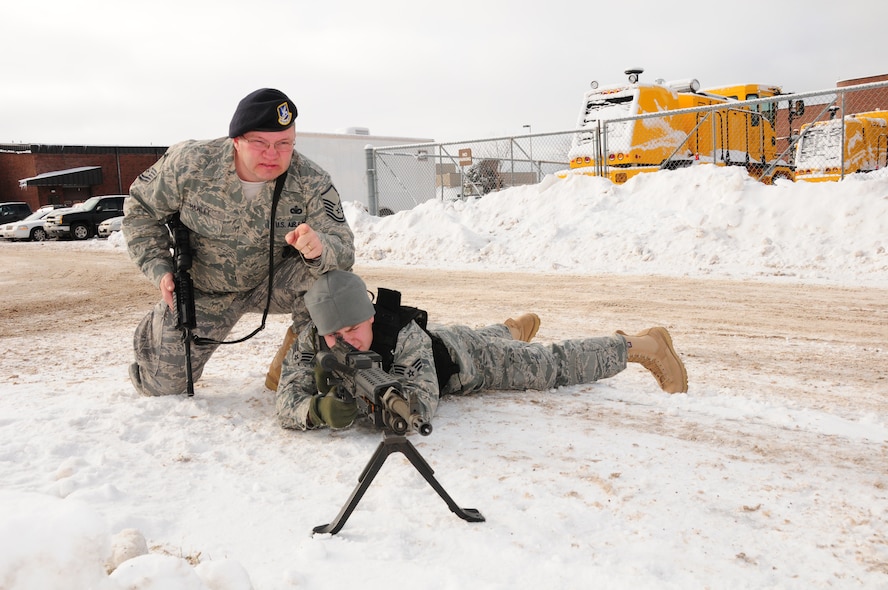 Master Sgt. William Hawley, member of the 148th Fighter Wing Security Forces Squadron, Minnesota National Guard, Duluth, Minn. provides guidance on firing from the prone position.  Sgt. Hawley is the winner of the 2010 Air National Guard Security Forces Senior Noncommissioned Officer of the Year Award.  
 (U.S. Air Force Photo by Tech. Sgt. Amie M. Dahl/ Released)
