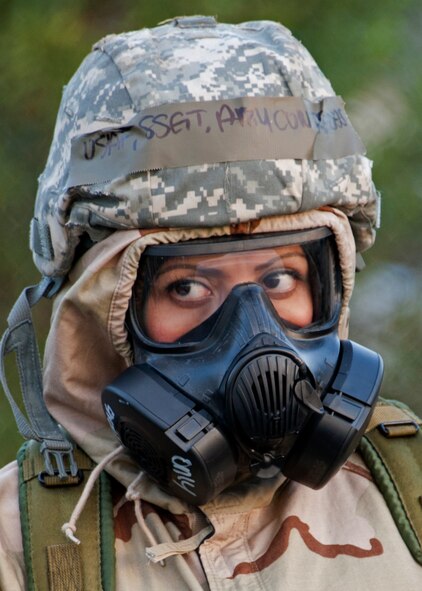 A staff sergeant wears the new M-50 gas mask and chemical suit top during her hands-on training at Eglin Air Force Base, Fla.  Gas masks and chemical gear are issued to Airmen prior to deploying or at their deployed location. (U.S. Air Force photo/ Samuel King Jr.)    