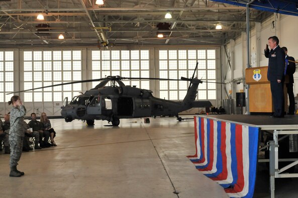 PATRICK AIR FORCE BASE, Fla. - Capt. Catherine Correa salutes the incoming 920th Aircraft Maintenance Squadron Commander, Lt. Col. David Cooksey here December 5.  An Operation Desert Storm and Shield veteran, Lieutenant Colonel Cooksey was born in Jacksonville and entered the Air Force in 1985 receiving his commission four years later though the U.S. Air Force Academy, Colorado Springs, Col.  The 920th RQW is an Air Force Reserve unit which performs more than 20 percent of the Air Force's combat search and rescue missions. The Wing is comprised of 1,500 Airmen and flies both fixed and rotor wing aircraft: the HC-130P/N extended-range Hercules and the HH-60G Pave Hawk helicopter. (U.S. Air Force photo/Capt. Ryan Liss)