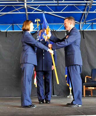 PATRICK AIR FORCE BASE, Fla. - Col. Charlene Nelson, Commander of the 920th Rescue Wing Maintenance Squadron, hands the guidon, and command of the 920th Aircraft Maintenance Squadron to Lt. Col. David Cooksey here December 5.  An Operation Desert Storm and Shield veteran, Lieutenant Colonel Cooksey was born in Jacksonville and entered the Air Force in 1985 receiving his commission four years later though the U.S. Air Force Academy, Colorado Springs, Col.  The 920th RQW is an Air Force Reserve unit which performs more than 20 percent of the Air Force's combat search and rescue missions. The Wing is comprised of 1,500 Airmen and flies both fixed and rotor wing aircraft: the HC-130P/N extended-range Hercules and the HH-60G Pave Hawk helicopter. (U.S. Air Force photo/Capt. Ryan Liss)