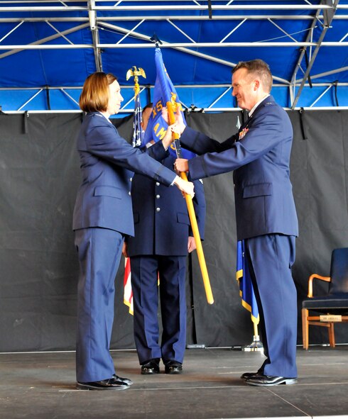 PATRICK AIR FORCE BASE, Fla. - Col. Charlene Nelson, Commander of the 920th Rescue Wing Maintenance Squadron, hands the guidon, and command of the 920th Aircraft Maintenance Squadron to Lt. Col. David Cooksey here December 5.  An Operation Desert Storm and Shield veteran, Lieutenant Colonel Cooksey was born in Jacksonville and entered the Air Force in 1985 receiving his commission four years later though the U.S. Air Force Academy, Colorado Springs, Col.  The 920th RQW is an Air Force Reserve unit which performs more than 20 percent of the Air Force's combat search and rescue missions. The Wing is comprised of 1,500 Airmen and flies both fixed and rotor wing aircraft: the HC-130P/N extended-range Hercules and the HH-60G Pave Hawk helicopter. (U.S. Air Force photo/Capt. Ryan Liss)
