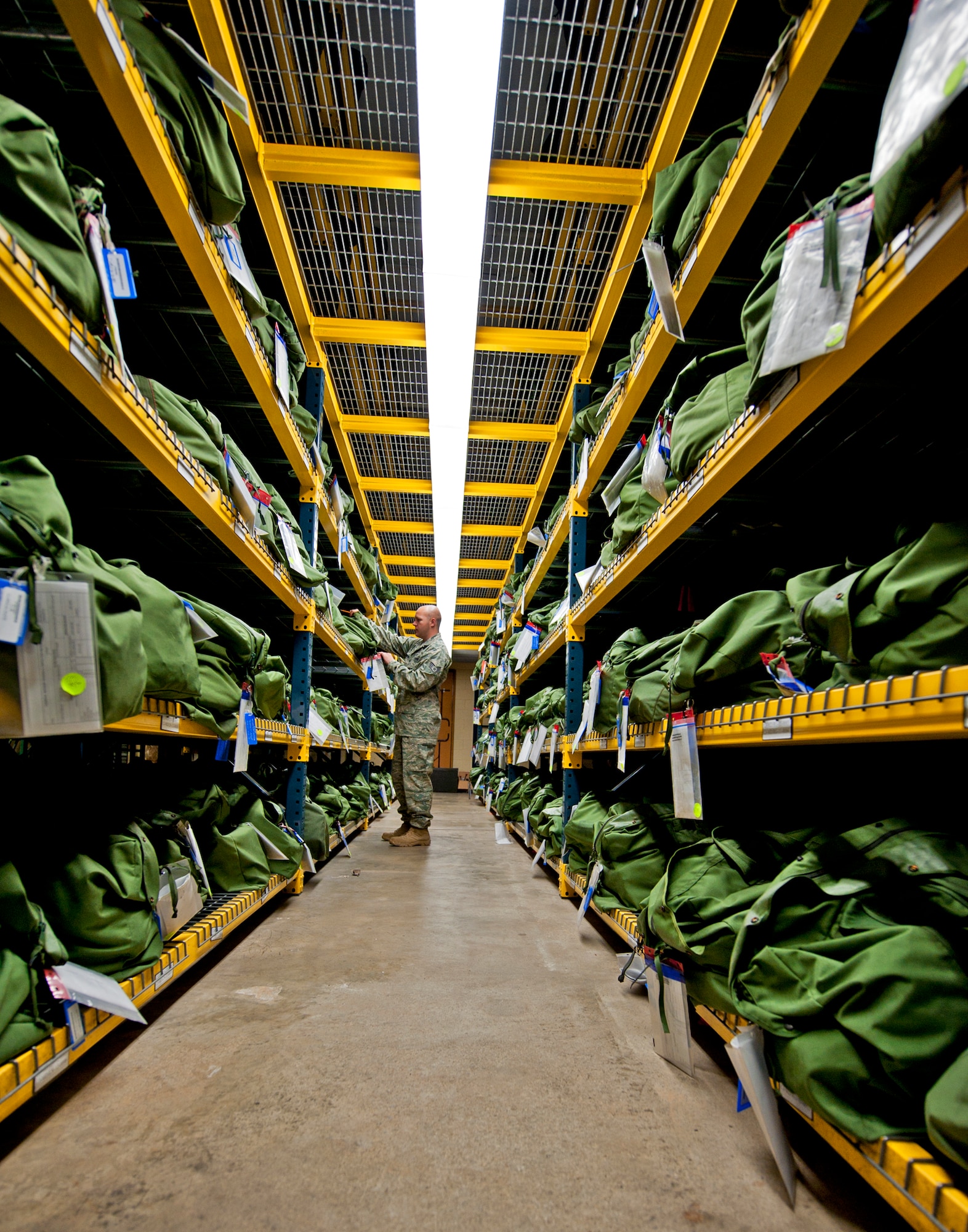 Staff Sgt. David Forston, 96th Logistics Readiness Squadron, checks the contents of the Air Force's "C" bag, which contains chemical gear issued to Airmen prior to deploying.  The material management flight maintains more than 700 C bags ready for issue.  (U.S. Air Force photo/ Samuel King Jr.)