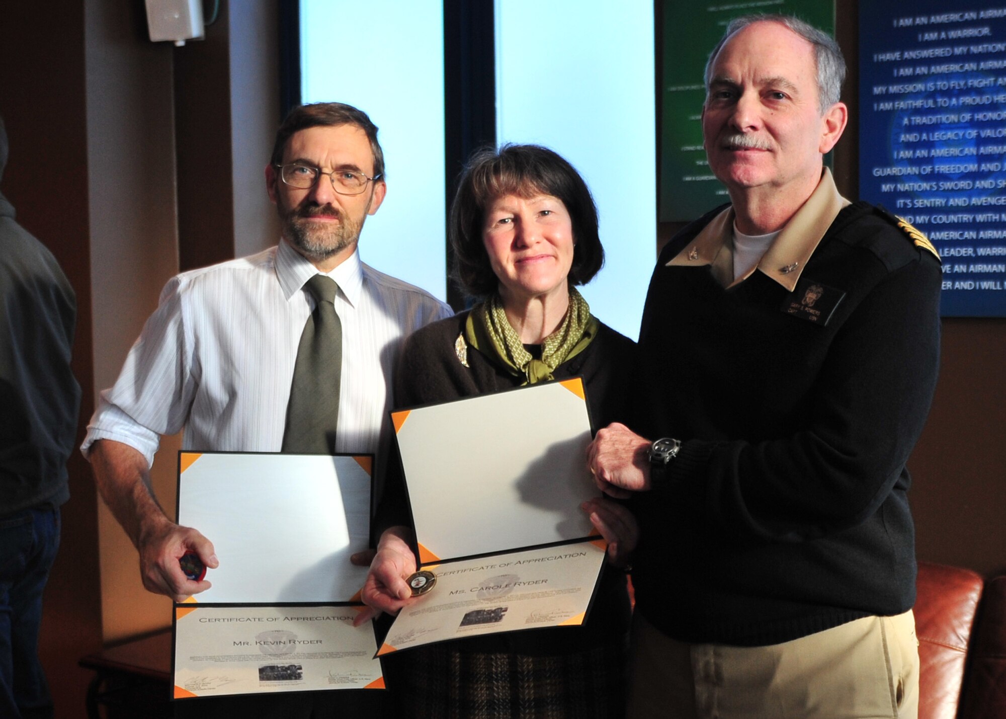 Kevin and Carole Ryder receive Certificates of Appreciation for their role in finding the machine gun from the B-17G Flying Fortress of the 2LT George A. Kyle crew that they found in the Cheviot Hills near the England Scotland border.  The plane crashed during a mission to Ulm, Germany on 16 December 1944. U.S. Air Force photo by Staff Sgt. Javier Cruz