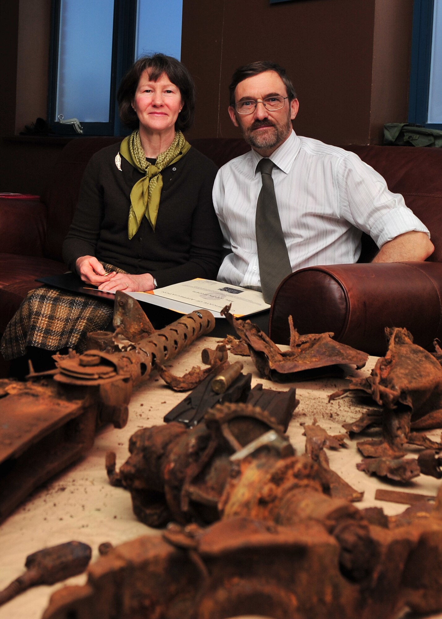 Kevin and Carole Ryder at Royal Air Force Molesworth on 3 December 2010 with the machine gun from the B-17G Flying Fortress of the 2LT George A. Kyle crew that they found in the Cheviot Hills near the England Scotland Border. The machine gun last left Molesworth on 16 December 1944 – almost 66 years earlier. U.S. Air Force photo by Staff Sgt. Javier Cruz