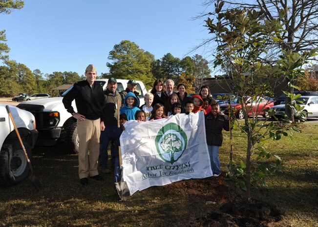 Navy Capt. Ralph Ward stands alongside members of the South Carolina Forestry Commission and Marrington Elementary School students after planting a tree at Marrington Elementary School on Joint Base Charleston-Weapons Station, S.C., Dec. 3, 2010. Students from second to fifth grade participated in Arbor day by planting a Southern Magnolia tree on school grounds. Captain Ward is the JB CHS deputy commander. (U.S. Air Force photo/Senior Airman Timothy Taylor)