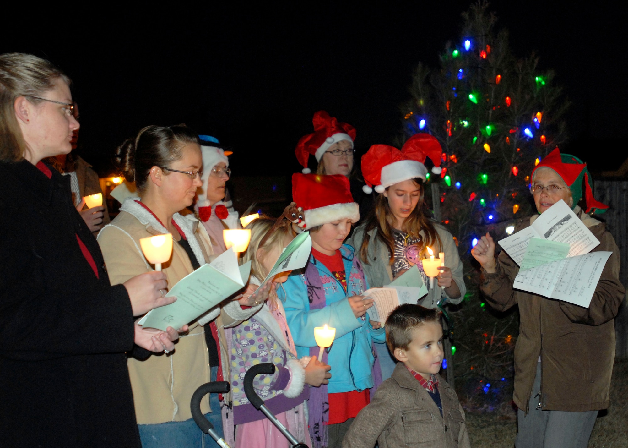 GOODFELLOW AIR FORCE BASE, Texas-- Carolers sing during the annual Goodfellow Tree Lighting Ceremony held Dec. 1 at the Base Chapel. The ceremony celebrated the beginning of the holiday season and included a motivational speech given by Col. Thomas Geary, 17th Training Wing Commander. (U.S. Air Force photo/Airman 1st Class Jessica D. Keith)