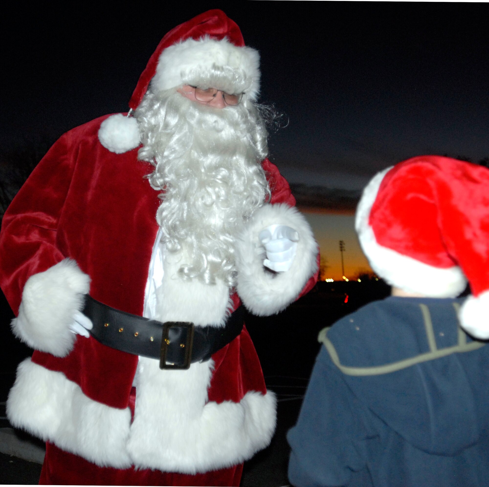 GOODFELLOW AIR FORCE BASE, Texas-- Santa pays a surprise visit to children after the annual Goodfellow Tree Lighting Ceremony at the Base Chapel Dec. 1. The ceremony celebrated the beginning of the holiday season and included carolers and a motivational speech given by Col. Thomas Geary, 17th Training Wing Commander. (U.S. Air Force photo/Airman 1st Class Jessica D. Keith)