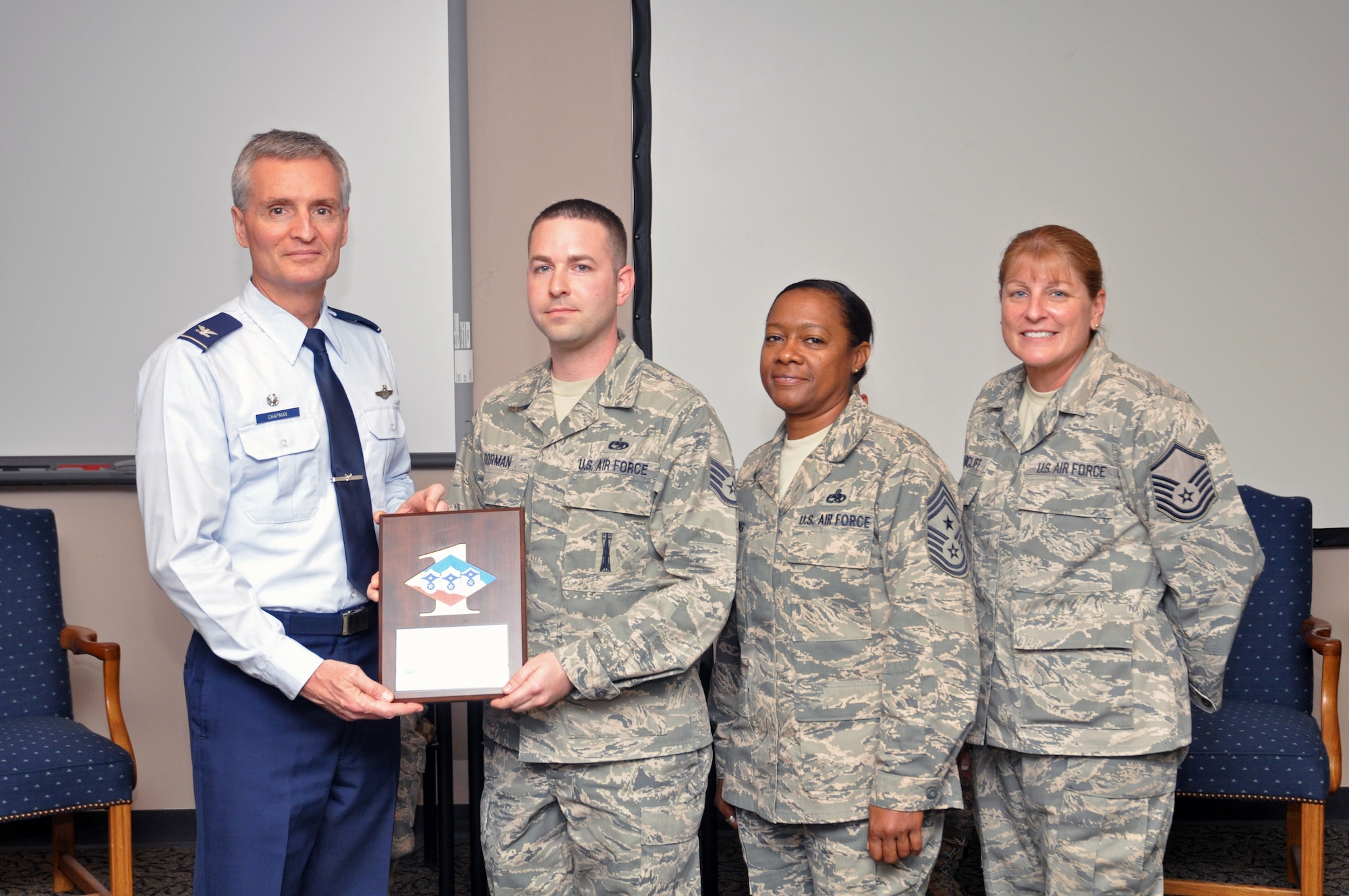 SSgt Andrew Dorman 81st Aerial Port Squadron, Charleston AFB SC received the diamond shart award from Col Steven Chapman, 315th Airlfit Wing Commander December 5. The award goes to airman who demonstrate the Air Force core values at work and through their volunteer efforts in the community. (U.S. Air Force Photo/ TSgt Scott Mathews)