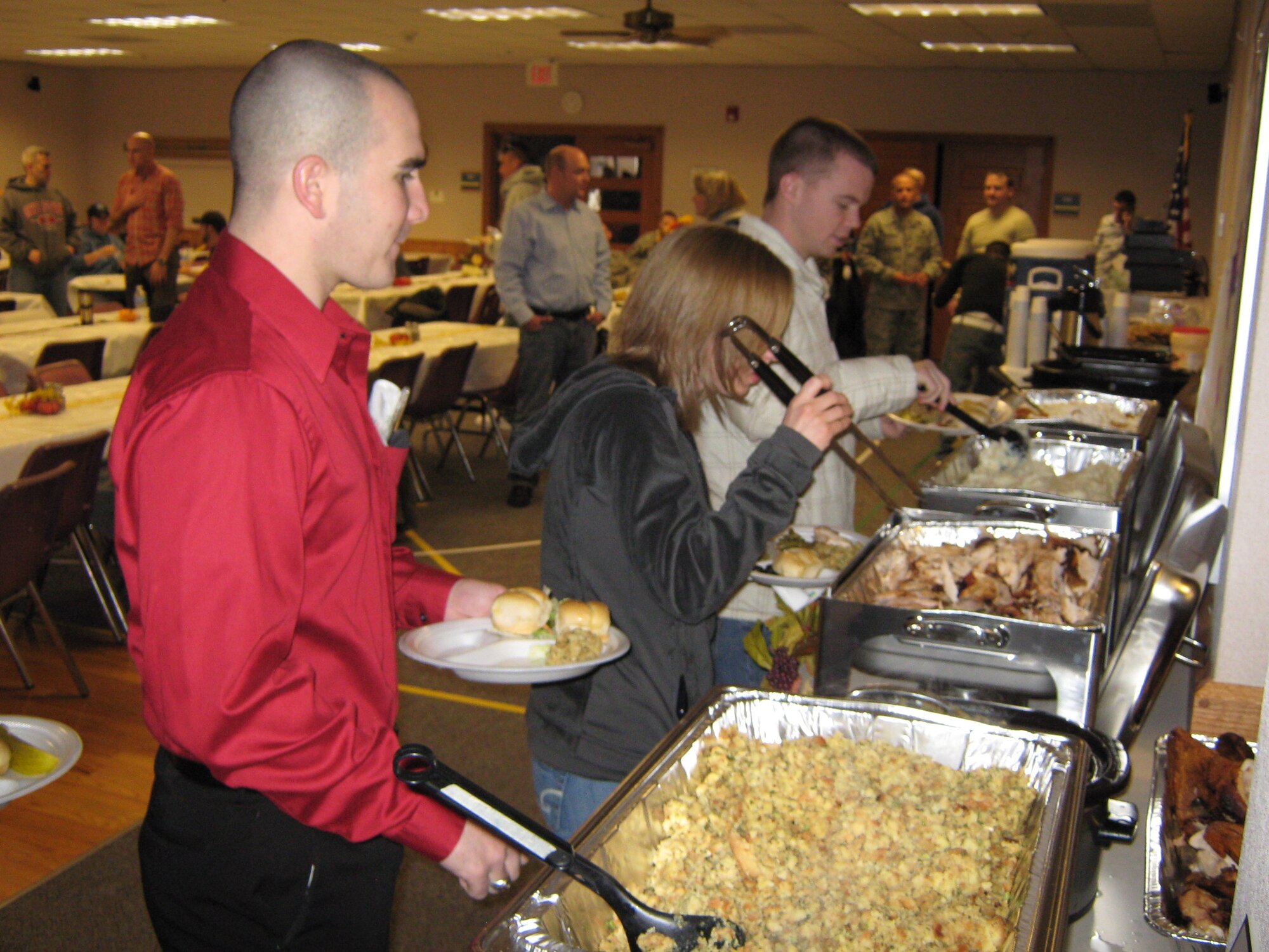 Airman 1st Class Eric Lyons, 90th Missile Security Forces Squadron gets some more Thanksgiving food during the 90th MSFS Thanksgiving feast. (U.S. Air Force photo by 2nd Lt. Dexter Binion)