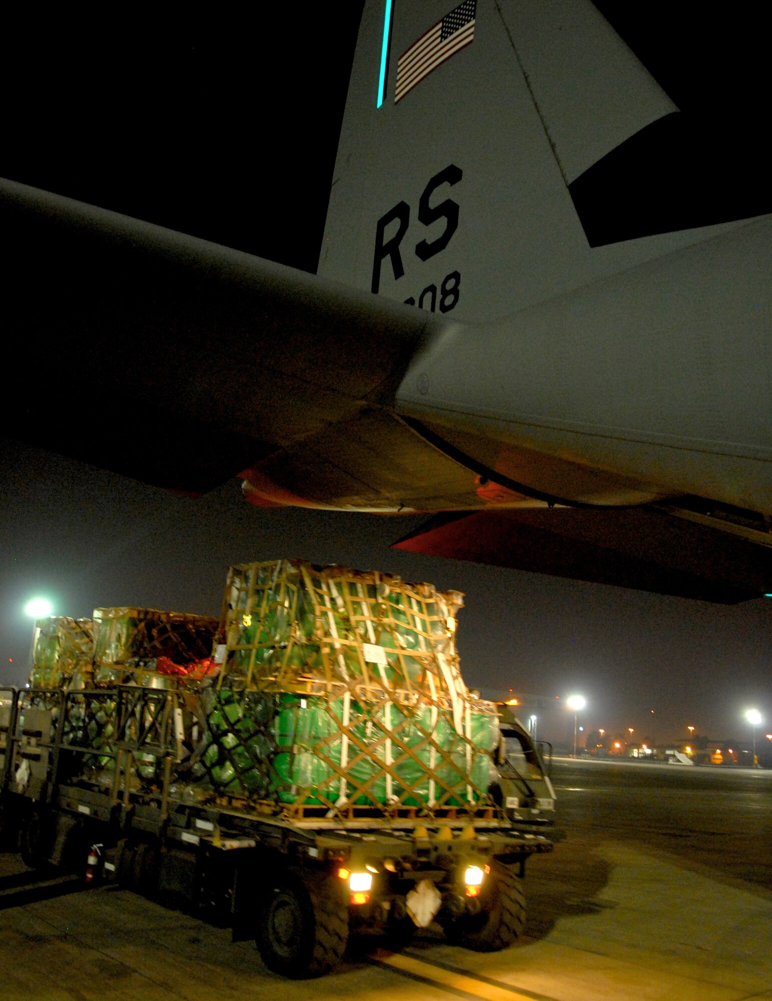 TEL AVIV, Israel – Israeli officials off load approximately 13.5 tons of fire suppression agent from a C-130J aircraft from Ramstein Air Base, Germany, onto an Israeli K-loader Sunday, Dec. 5, 2010, at Tel Aviv International Airport. So far the United States has donated 30,000 liters of fire retardant, with plans to deliver 60,000 more over the next three days to aid firefighting efforts in Israel. (U.S. Air Force photo by Capt. John Ross)