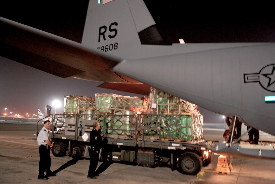 TEL AVIV, Israel – Israeli officials off load approximately 13.5 tons of fire suppression agent from a C-130J aircraft from Ramstein Air Base, Germany, onto an Israeli K-loader Sunday, Dec. 5, 2010, at Tel Aviv International Airport. So far the United States has donated 30,000 liters of fire retardant, with plans to deliver 60,000 more over the next three days to aid firefighting efforts in Israel. (U.S. Air Force photo by Capt. John Ross)
