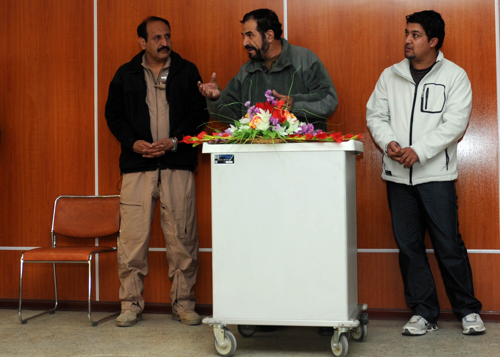 101206-N-6541W-016 KABUL, Afghanistan - Gen. Darwan, Commanding General of the Afghan Air Force speaks to seven newly graduated flight medics in the Afghan Air Force at Afghan Air Force Base on Kabul International Airport, Dec. 6. This is the first medical course to be instructed by an Afghan Air Force flight medic instructor.  (U.S. Navy photo by Mass Communication Specialist 3rd Class Jared Walker/ RELEASED).