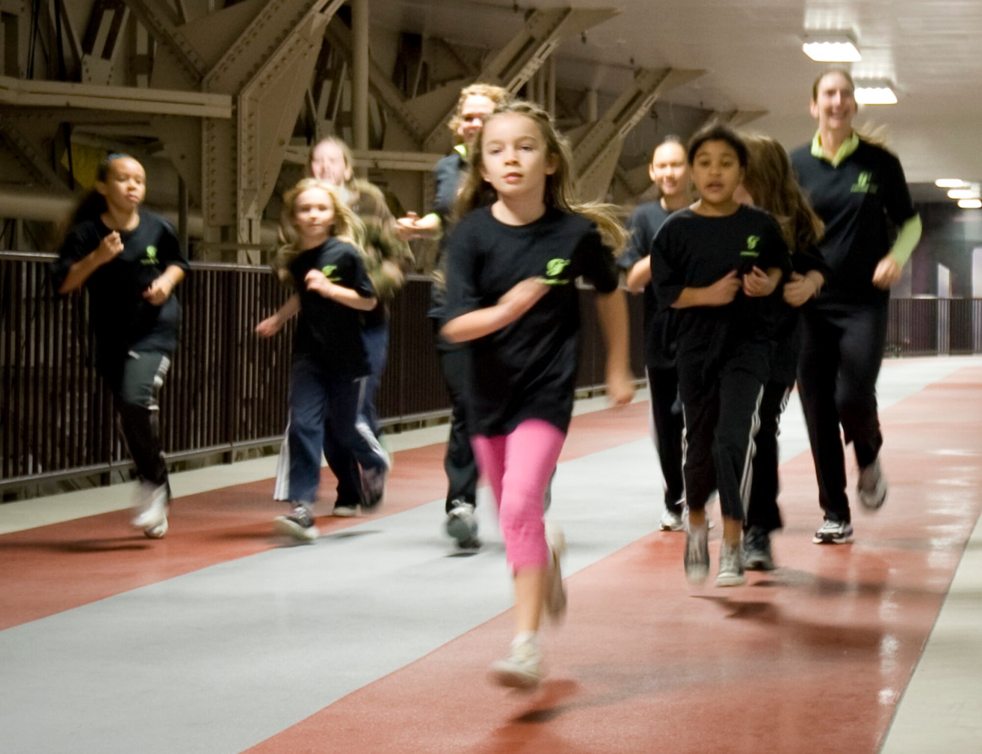Members of the Misawa GoGirlGo! organization race on the new, elevated track inside of the Weasels' Den at Misawa Air Base, Japan, Dec 4, 2010. GoGirlGo! is the primary programming focus of the Women’s Sports Foundation, promoting fitness and an active lifestyle amongst young women. (U.S. Air Force photo by Airman James B. Bauer/Released)