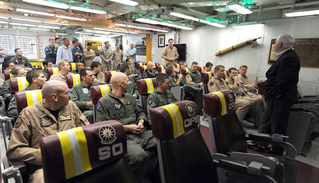 U.S. Defense Secretary Robert M. Gates talks with naval aviators in the ready room while aboard the USS Abraham Lincoln, which is under way in the Arabian Sea, Dec. 6, 2010.
