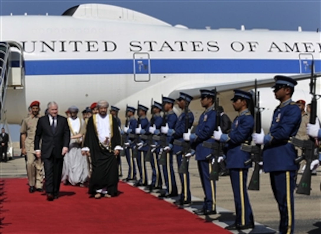 Secretary of Defense Robert M. Gates (left) is greeted by Omani Defense Affairs Minister Sayyid Badr bin Saud bin Harib al-Busaidi and receives honors during his arrival in Muscat, Oman, on Dec. 5, 2010.  