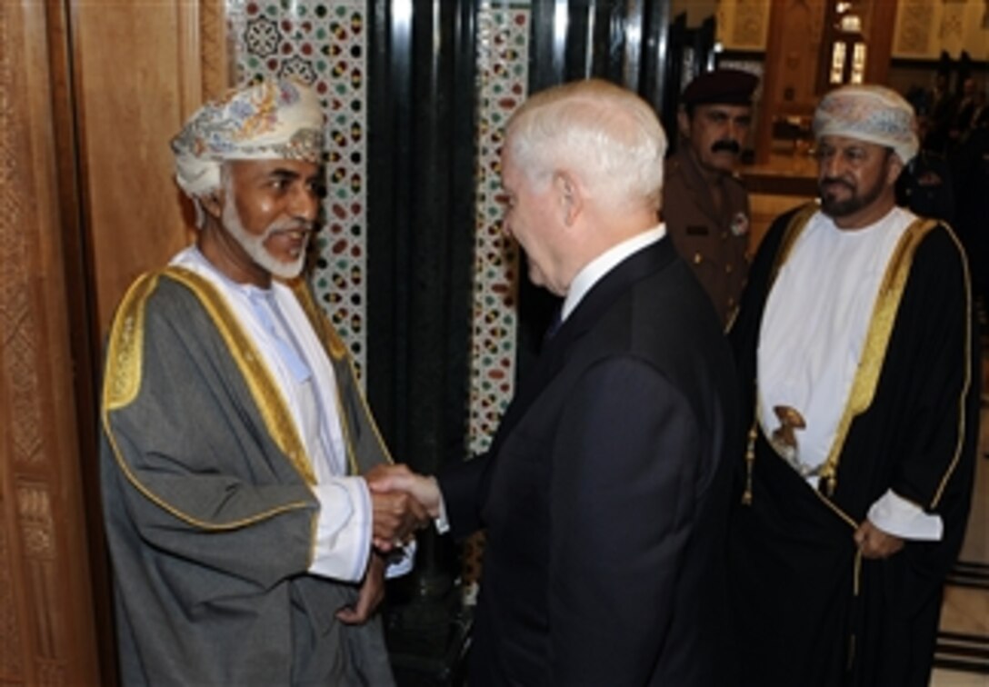 Secretary of Defense Robert M. Gates is greeted by Omani Sultan Qaboos at the Bait Al Baraka Palace in Muscat, Oman, on Dec. 5, 2010.  