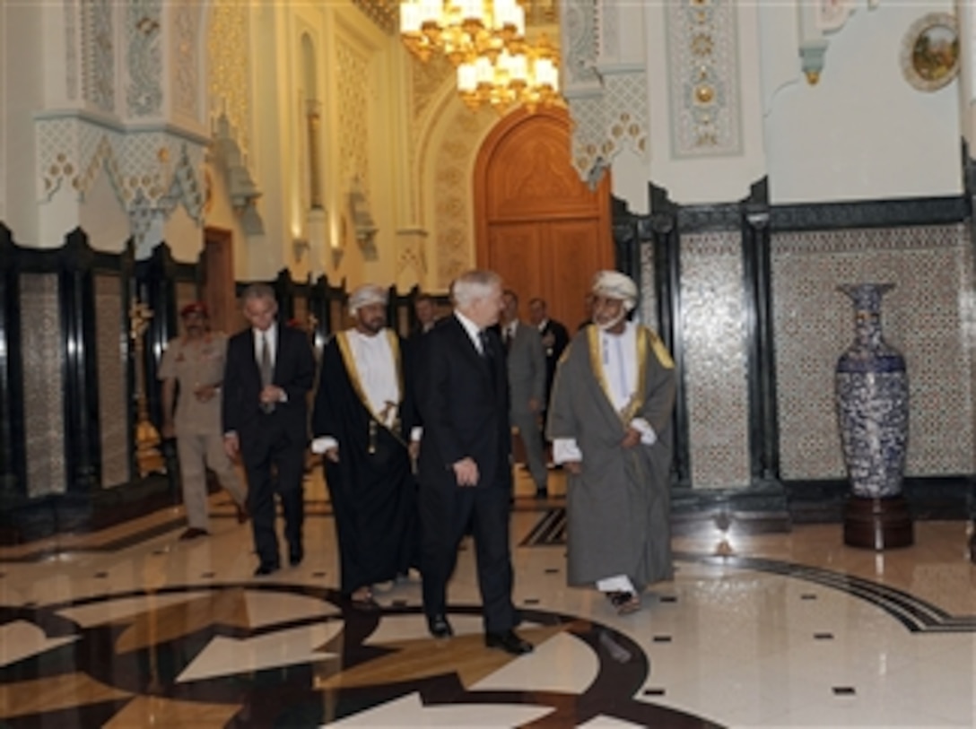 Secretary of Defense Robert M. Gates walks with Omani Sultan Qaboos at the Bait Al Baraka Palace in Muscat, Oman, on Dec. 5, 2010.  