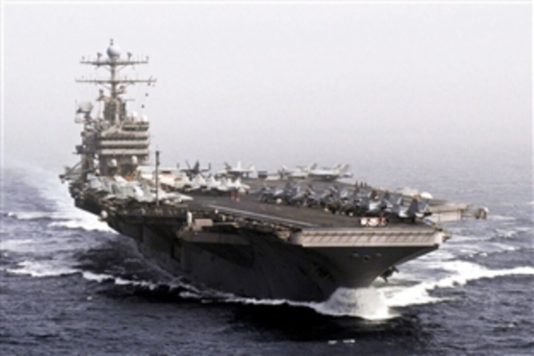 The aircraft carrier USS Abraham Lincoln conducts flight operations as it transits the Arabian Sea, Dec. 5, 2010. The Abraham Lincoln Carrier Strike Group is conducting maritime security operations and theater security cooperation efforts to establish conditions for regional stability. Defense Secretary Robert M. Gates arrived on board Dec. 6 for an overnight visit with the Lincoln crew.