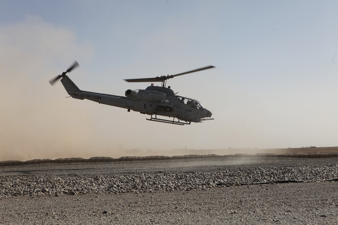 An AH-1W Super Cobra with Marine Light Attack Helicopter Squadron 169, 3rd Marine Aircraft Wing (Forward) departs from Forward Operating Base Dwyer, Afghanistan to provide close air support on a joint Tactical Airstrike Request.  The Cobra is one of several stationed at FOB Dwyer as part of a HMLA-169 detachment, which provides quick-response close air support for coalition and Afghan forces within the area.