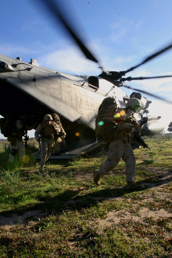 Marines from 1st Battalion, 23rd Marine Regiment disembark a CH-53E "Super Stallion" at Marine Corps Base Camp Pendleton, Calif., Dec. 6. Marine Heavy Helicopter Squadron 462 flew to Camp Pendleton to support the reserve unit's predeployment training.