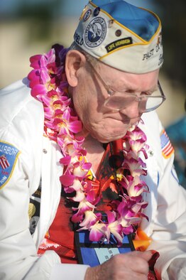 Frank Karas, a Hickam Field survivor of the Dec. 7, 1941 attacks, chokes up as "God Bless America" is sung by the Pacific Air Forces Band Dec. 7, 2010. The remembrance ceremony hailed and commemorated the actions of the service members and civilians that responded to the attacks, many giving their lives in the line of fire for their country. (U.S. Air Force Photo/Airman 1st Class Lauren Main)