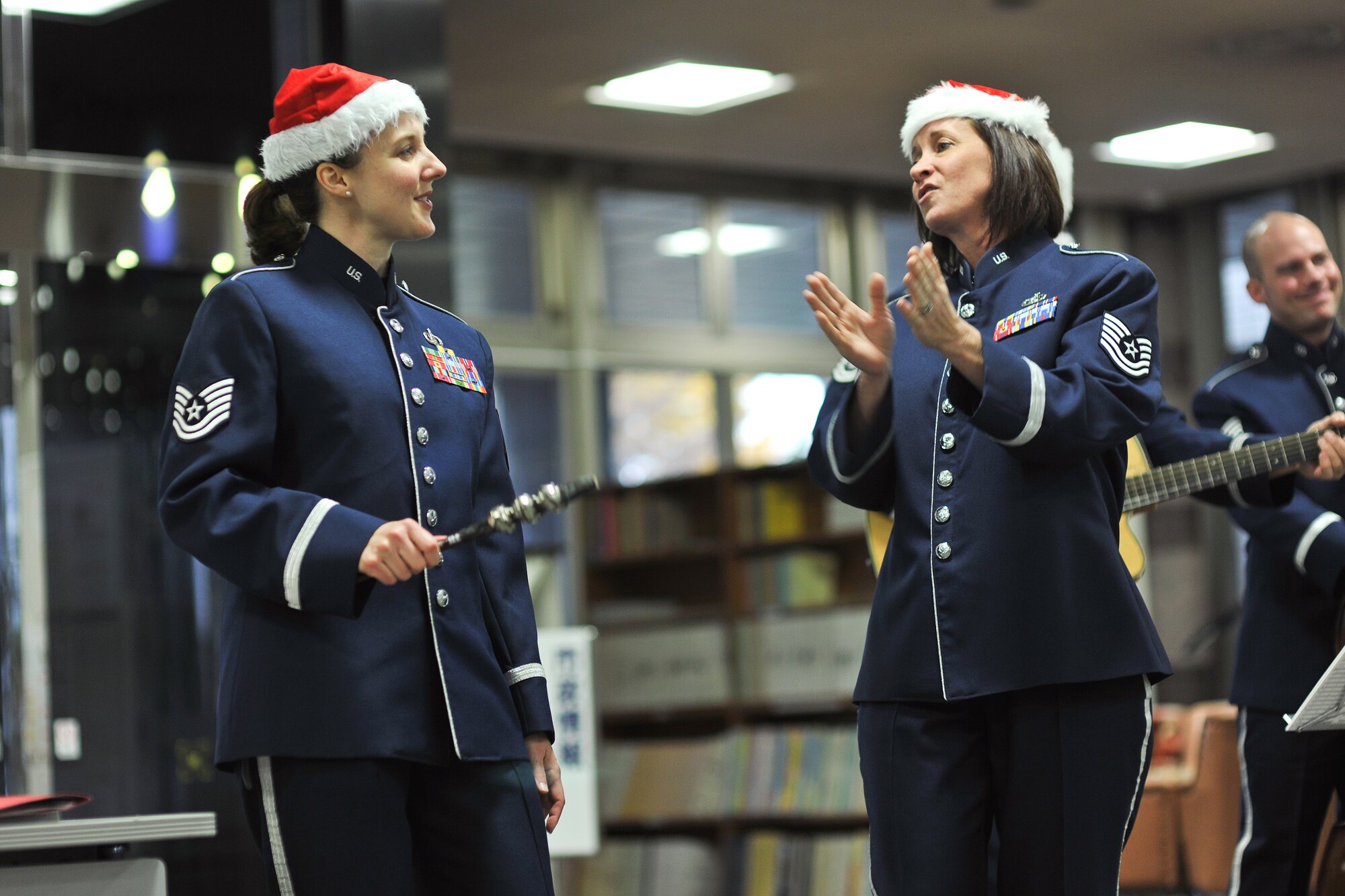 HAMURA, Japan -- Tech. Sgt. Paula Goetz (left) and Tech. Sgt. Rebecca Packard (right), both from the U.S. Air Force Band of the Pacific-Asia, perform carols at Hamura city hall Dec. 7. (U.S. Air Force photo/Osakabe Yasuo)