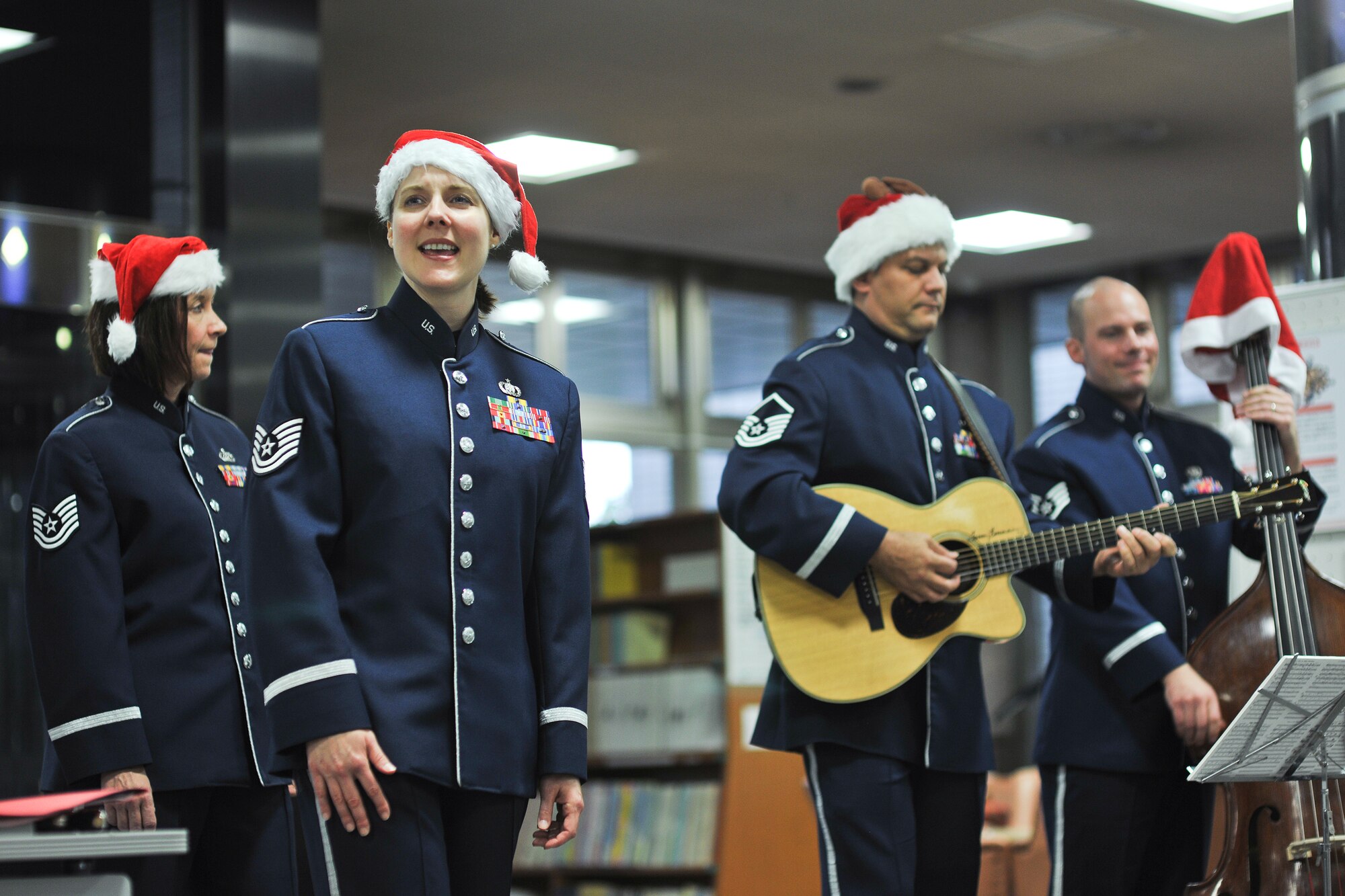 HAMURA, Japan -- Members of the U.S. Air Force Band of Pacific-Asia perform carols at Hamura city hall Dec. 7.  The PACAF Band delivers carols to Yokota's off-base neighbors every year. (U.S. Air Force photo/Osakabe Yasuo) 