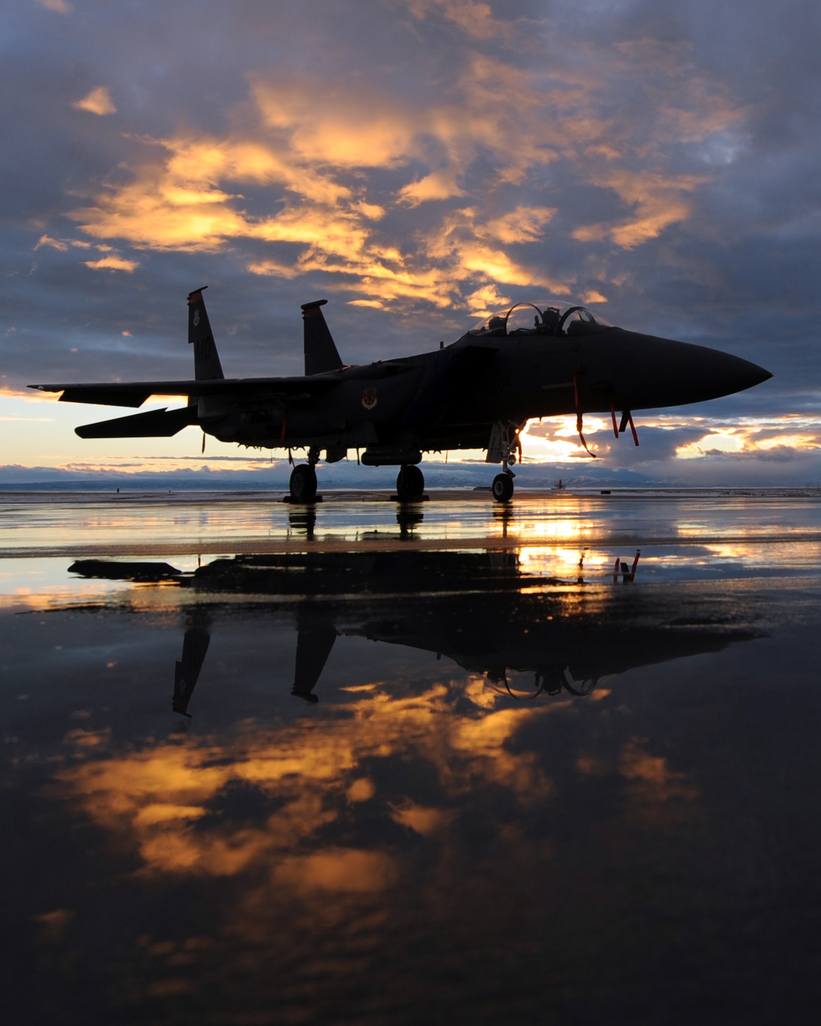 MOUNTAIN HOME AIR FORCE BASE, Idaho – An F-15E Strike Eagle assigned to the 391st Fighter Squadron sits on the flightline during sunset, Dec. 6. With a digital electronic engine control system, F-15E pilots can accelerate from idle power to maximum afterburner in less than four seconds. Faster engine acceleration means quicker takeoffs and crisper response while maneuvering. (U.S. Air Force photo by Senior Airman Debbie Lockhart)