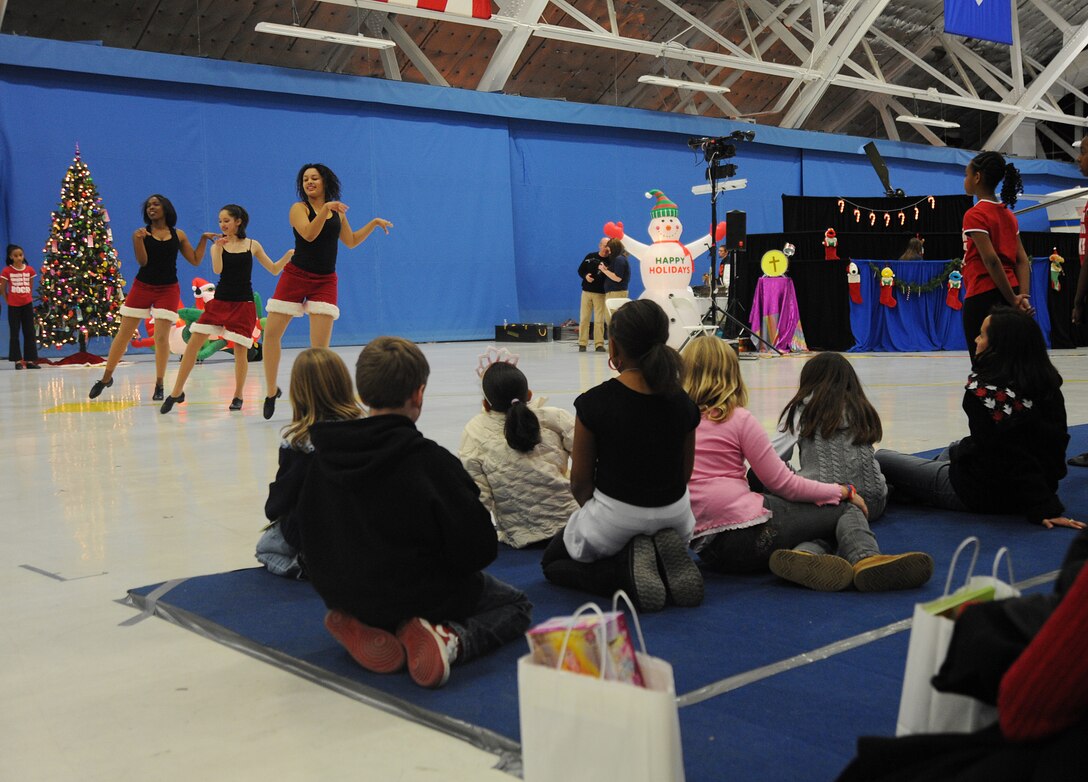 JOINT BASE ANDREWS, Md. -- Members of Agency 9 Performing Dance Company out of Clinton, Md., perform a tap number for attendees of the Parents and Children Fighting Cancer holiday party at here, Dec. 4. Performing Dance Company is made up of children ages 5-16. They have performed at Howard University, national Christmas tree lighting ceremony, the Joint Base Andrews Air show and other Andrews events. (U.S. Air Force photo by Senior Airman Melissa V. Brownstein)
