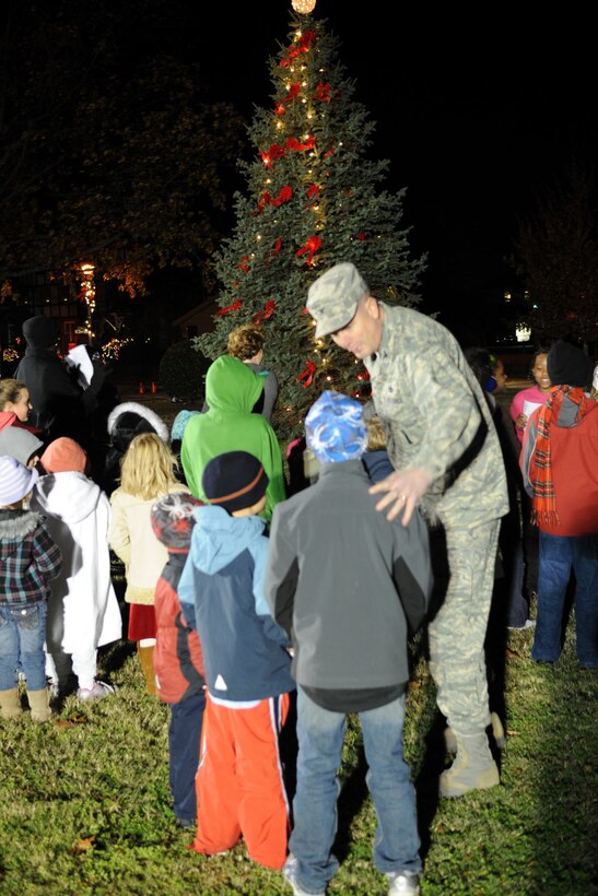 LANGLEY AIR FORCE BASE, Va -- Col. Donald Kirkland, 633d Air Base Wing commander, helps Airmen’s children of Langley Air Force Base light the Christmas tree Dec. 1. Langley Air Force Base’s 43rd annual Christmas tree lighting ceremony kicked off the holiday season on the chapel lawn with seasonal music and a special visit from Santa Claus. (U.S. Air Force photo/Airman 1st Class Racheal Watson)(RELEASED)