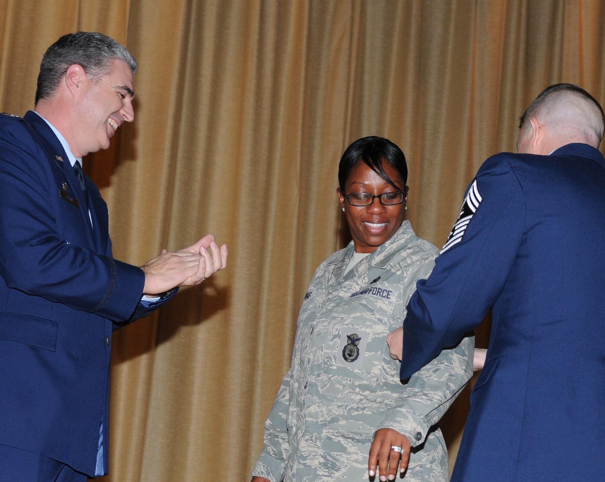GOODFELLOW AIR FORCE BASE, Texas – Col. Thomas Geary, 17th Training Wing Commander, promotes former Staff Sgt. Sabrina Lukas, 17th Security Forces Squadron, to technical sergeant under the Stripes for Exceptional Performers program as Chief Master Sgt. Brendan Criswell, 17th TRW Command Chief, puts on her new stripes Dec. 1. The Stripes for Exceptional Performers program is a wing commander’s opportunity to recognize and promote truly outstanding Airmen.  (U.S. Air Force photo/Airman 1st Class Clayton Lenhardt)