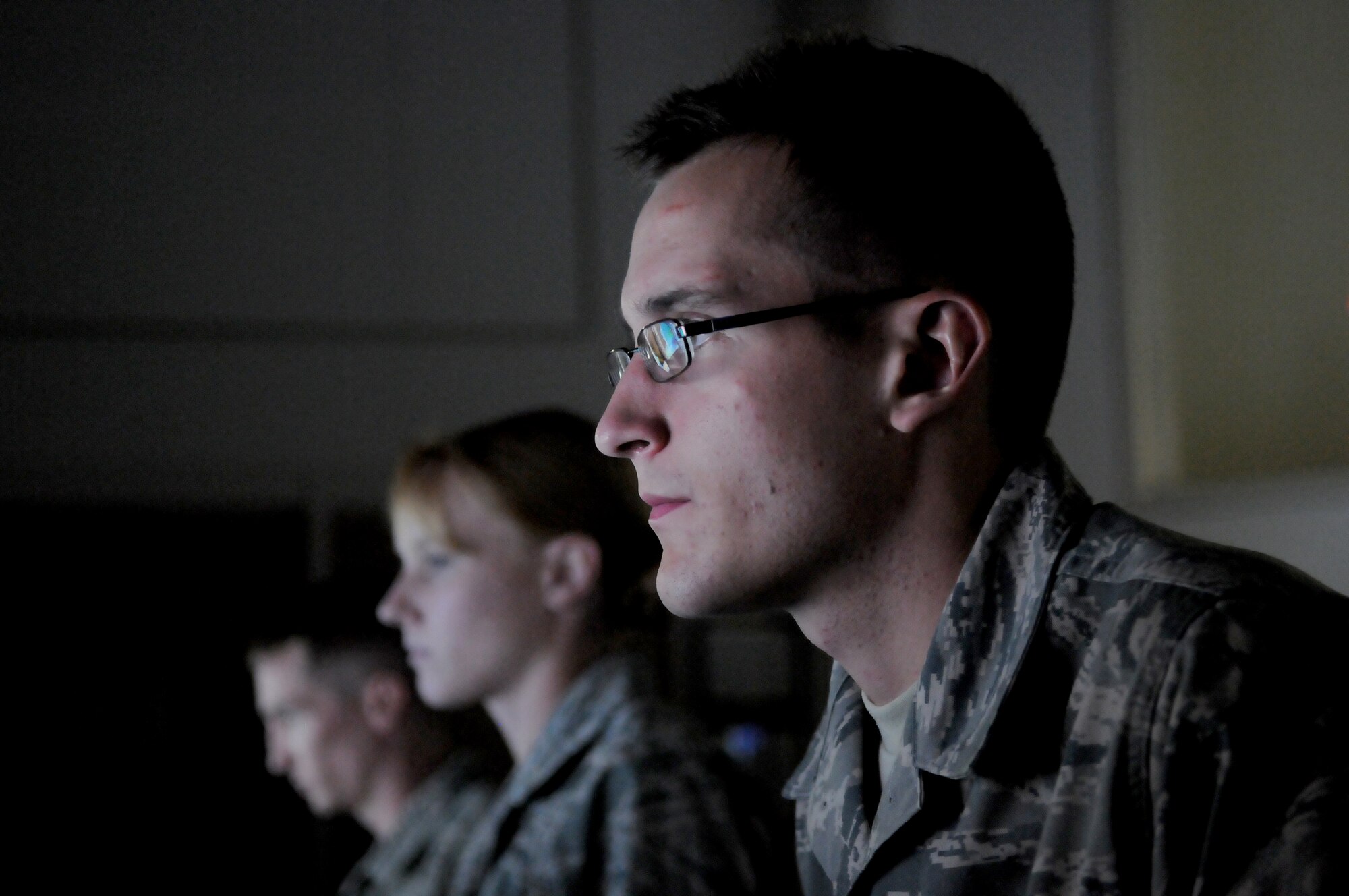GOODFELLOW AIR FORCE BASE, Texas - Airmen 1st Class Garret Schick, April Morlan, and Richard McMillan, 316th Training Squadron, monitor their “systems” for activity during their end of course exercise OPERATION LONESHARK, Nov. 17.  The exercise is a key part of the squadron’s training to prepare servicemembers for their first duty assignment within the intelligence career field.  (U.S. Air Force photo/Airman 1st Class Clayton Lenhardt)