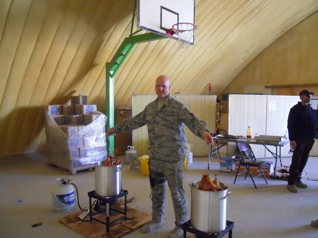 Tech Sgt. Pete Tascione, 438 AMXS, displays his turkey frying talents while deployed to Kabul Afghanistan. 