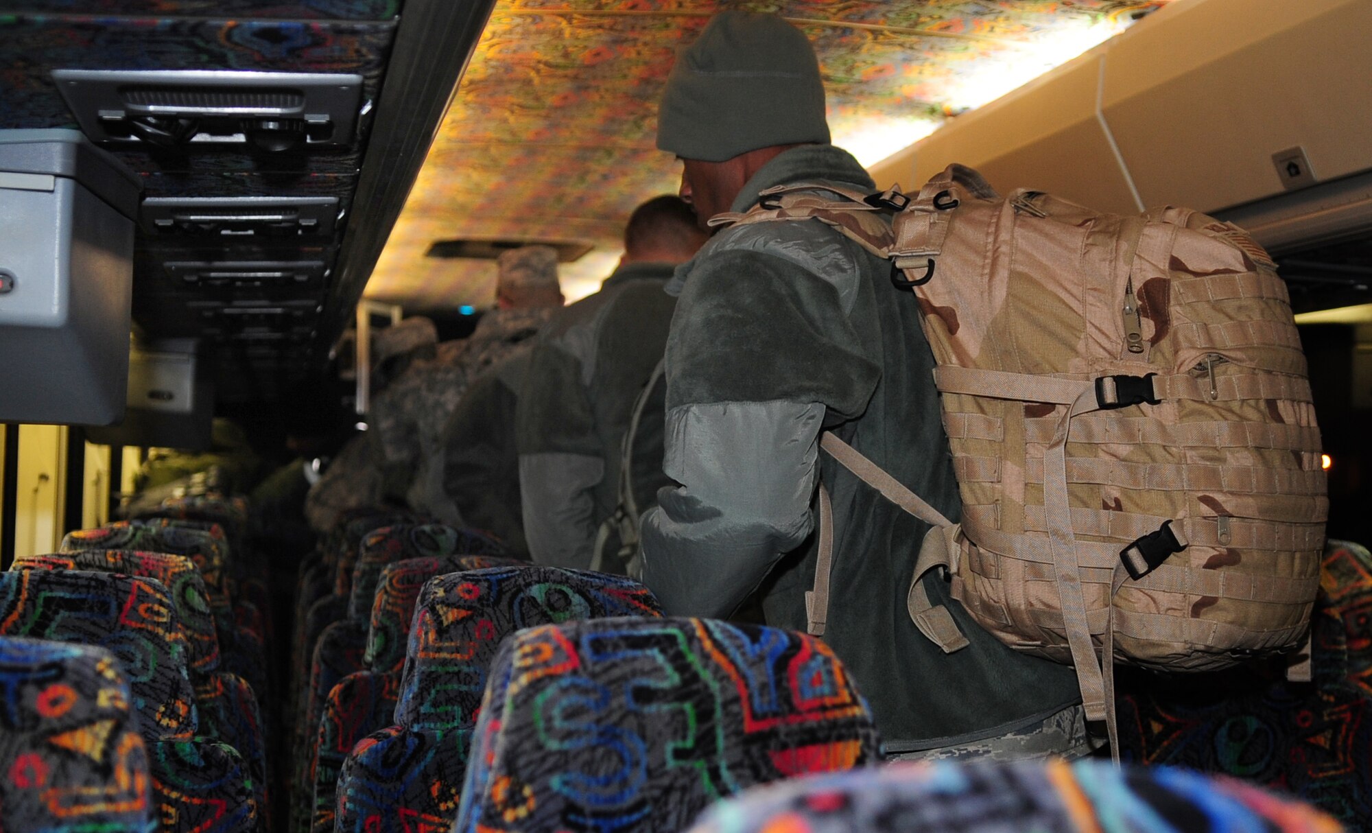 MOODY AIR FORCE BASE, Ga. -- Members from the 820th Base Defense Group find their seats on a bus. They will be deploying to Afghanistan for the first time to help train Afghan security forces members and provide base security. (U.S. Air Force photo/Senior Airman Stephanie Mancha)(RELEASED)
