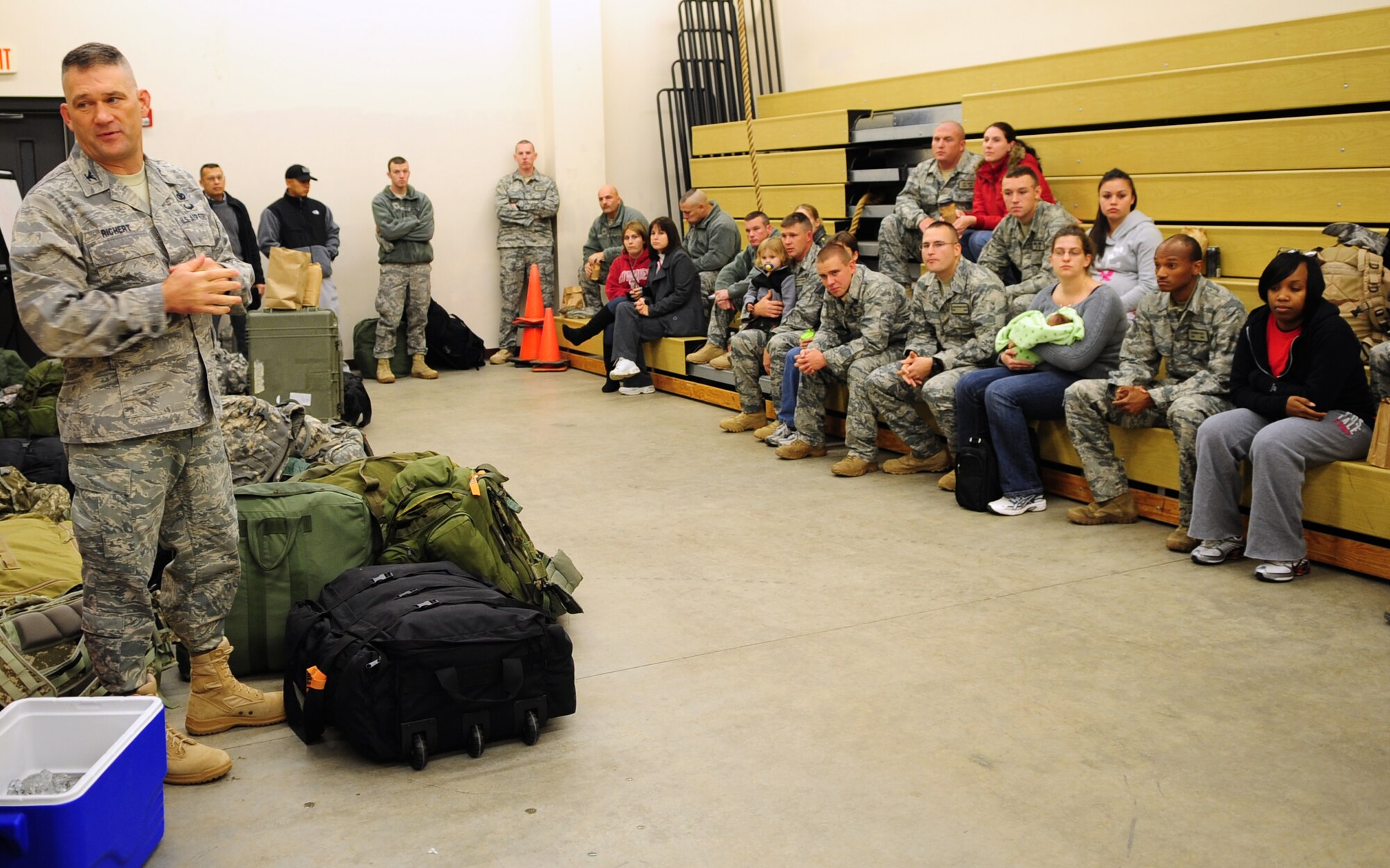 MOODY AIR FORCE BASE, Ga. -- Col. Randall Richert, 820th Base Defense Group commander, briefs deployers and their families, before they leave.  Members of the 820th BDG will take a four hour bus drive to Atlanta, Ga., before boarding a plane to Afghanistan.  (U.S. Air Force photo/Senior Airman Stephanie Mancha)(RELEASED)