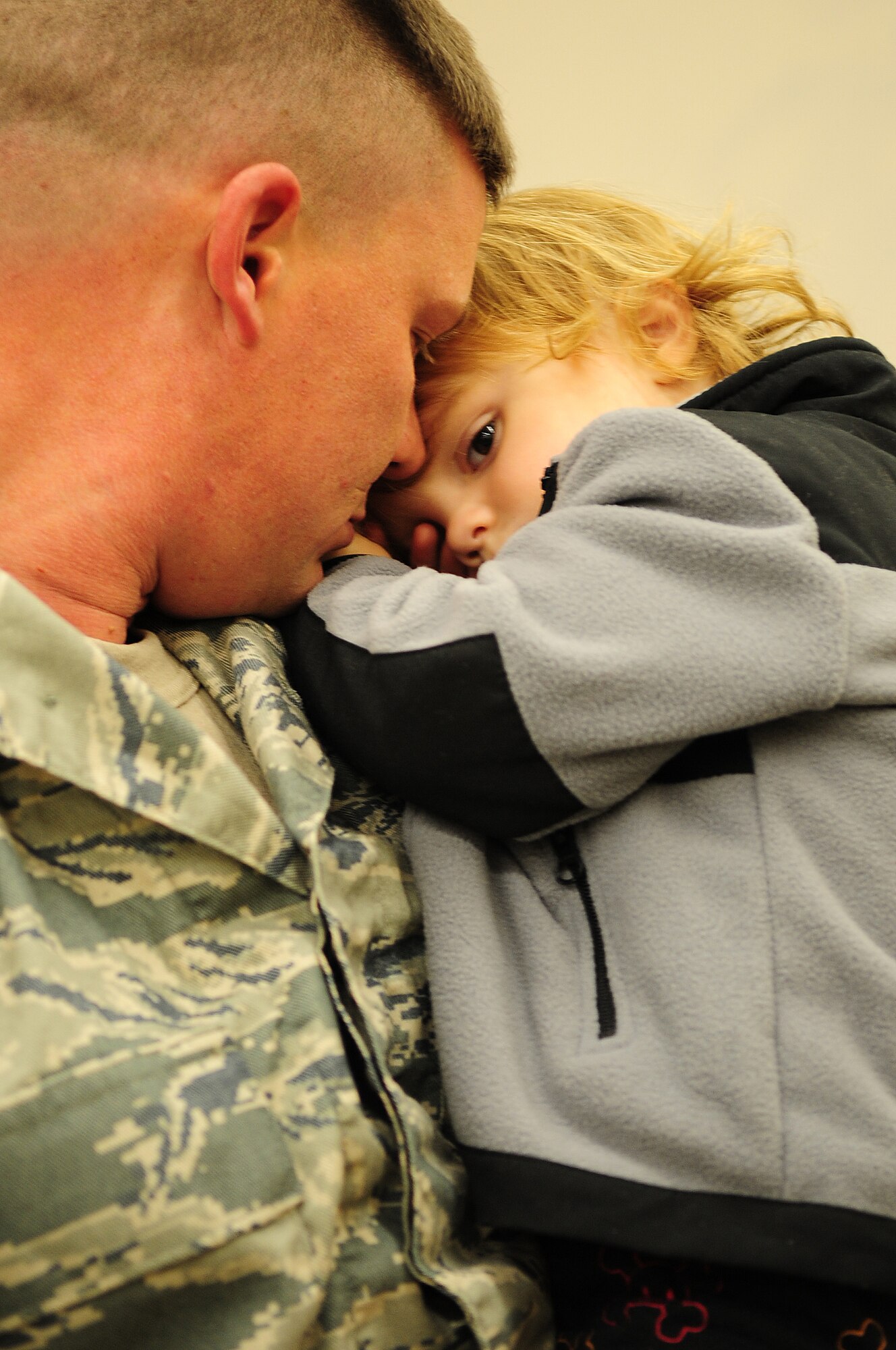 MOODY AIR FORCE BASE, Ga. -- Staff Sgt. Nathan Carter, 823rd Base Defense Squadron, takes a moment to hold his son Landon Carter, 2 years old, one last time before he deploys. This is Sergeant Carter's sixth deployment. (U.S. Air Force photo/Senior Airman Stephanie Mancha)(RELEASED)